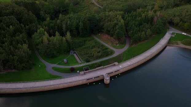 Aerial view of curved concrete dam wall in Germany. Aerial view of curved concrete dam wall in Germany.
