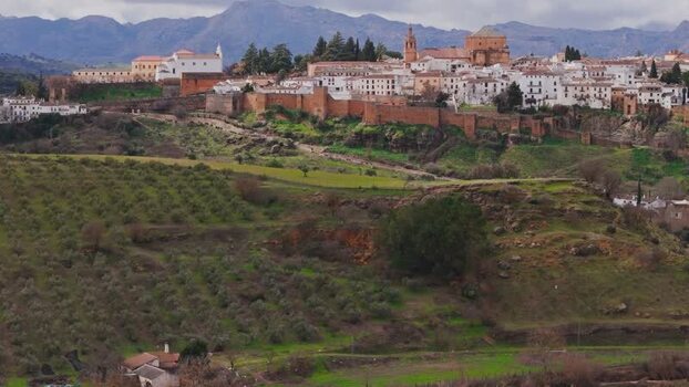 Aerial view of the historic walled city and cliffs in Ronda Spain. Aerial view of the historic walled city and cliffs in Ronda Spain.