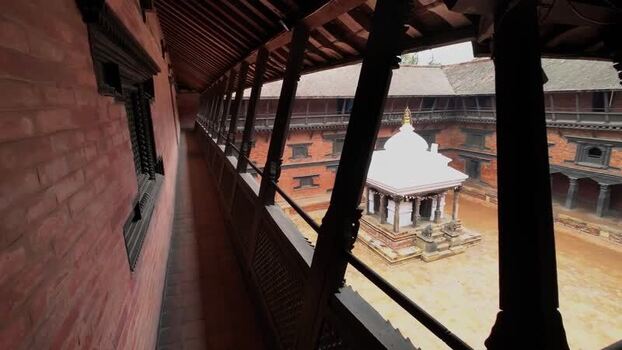 View of a traditional courtyard with a white shrine Nepal.