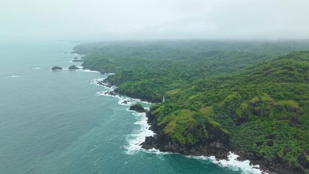 Aerial view of Bukit Pengilon cliffs and the rocky coastline Indonesia.