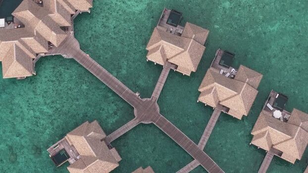 Aerial view of luxury overwater bungalows and walkways Maldives. Aerial view of luxury overwater bungalows and walkways Maldives.