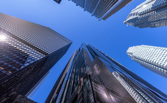 View of modern glass skyscrapers and office buildings reaching toward a clear blue sky in the financial district of Toronto Ontario Canada. View of modern glass skyscrapers and office buildings reaching toward a clear blue sky in the financial district of Toronto Ontario Canada.