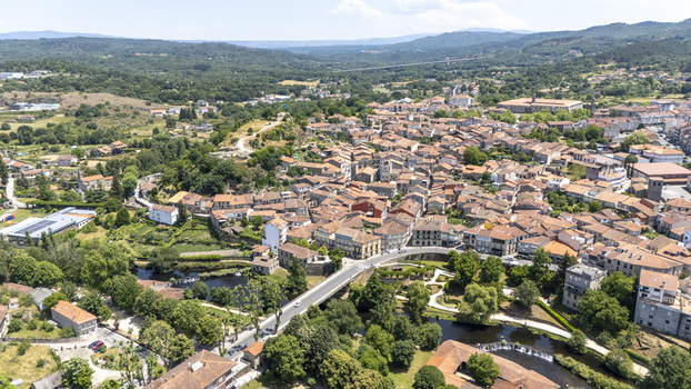 Aerial view of the historic town of Allariz with stone buildings terracotta rooftops and the Arnoia River in Allariz Province of Ourense Spain. Aerial view of the historic town of Allariz with stone buildings terracotta rooftops and the Arnoia River in Allariz Province of Ourense Spain.
