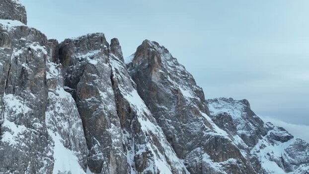 Aerial view of snow covered mountain peaks Italy.