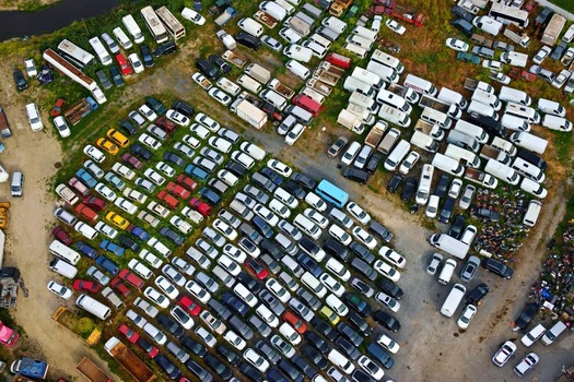 Aerial view of hundreds of colorful cars and white vans parked in dense rows at a large vehicle storage facility Silivri Istanbul Turkey. Aerial view of hundreds of colorful cars and white vans parked in dense rows at a large vehicle storage facility Silivri Istanbul Turkey.