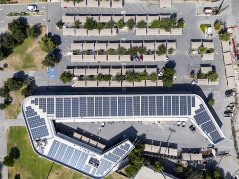 Aerial view of the solar panel array on the roof of a building at Fundidora Paseo de la Mujer Park with adjacent parking lots featuring shade structures in Monterrey Nuevo Leon Mexico. Aerial view of the solar panel array on the roof of a building at Fundidora Paseo de la Mujer Park with adjacent parking lots featuring shade structures in Monterrey Nuevo Leon Mexico.