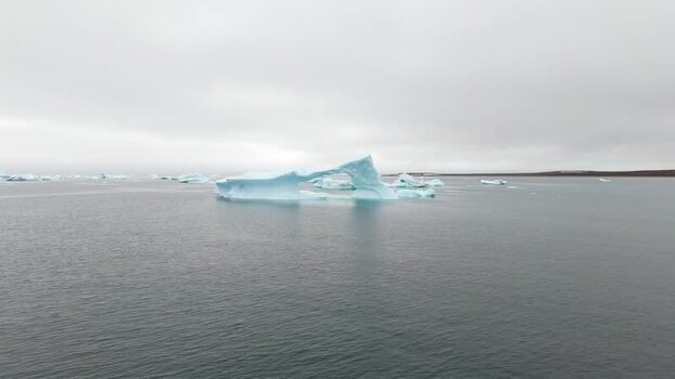 Aerial view of icebergs floating in the Arctic sea Greenland. Aerial view of icebergs floating in the Arctic sea Greenland.