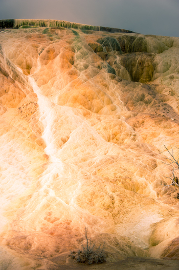 View of the colorful travertine terraces at Mammoth Hot Springs with mineral deposits and unique geological formations in Yellowstone National Park United States.