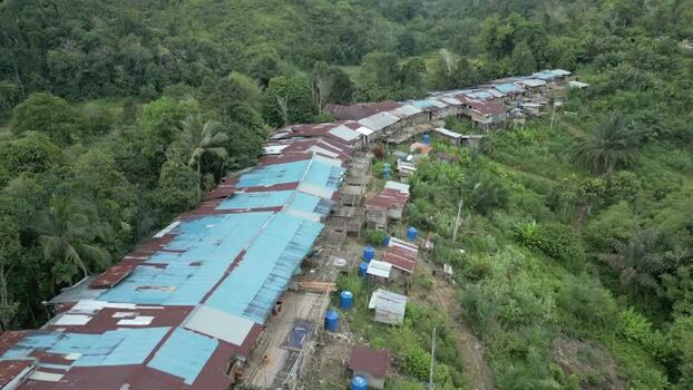 Aerial view of Batang Ai longhouse in the rainforest Malaysia. Aerial view of Batang Ai longhouse in the rainforest Malaysia.