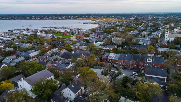 View of Nantucket Island featuring historic buildings dense rooftops and the harbor in Nantucket Massachusetts United States.