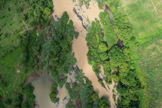 Aerial view of the Asejire Dam its concrete structure stark against the muddy water and vibrant green vegetation Asejire Oyo Nigeria. Aerial view of the Asejire Dam its concrete structure stark against the muddy water and vibrant green vegetation Asejire Oyo Nigeria.