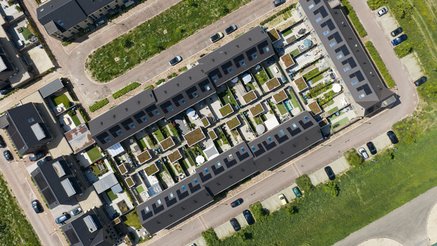 Aerial view of Ecodorp Zuiderveld featuring modern sustainable housing with solar panels green rooftops and private gardens in Nijmegen Gelderland Netherlands. Aerial view of Ecodorp Zuiderveld featuring modern sustainable housing with solar panels green rooftops and private gardens in Nijmegen Gelderland Netherlands.