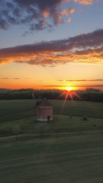 Aerial view of the historic stone windmill at sunset Czechia. Aerial view of the historic stone windmill at sunset Czechia.