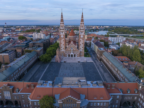 Aerial view of Szeged Cathedral and the historic Dom ter square surrounded by urban rooftops in Szeged Hungary. Aerial view of Szeged Cathedral and the historic Dom ter square surrounded by urban rooftops in Szeged Hungary.