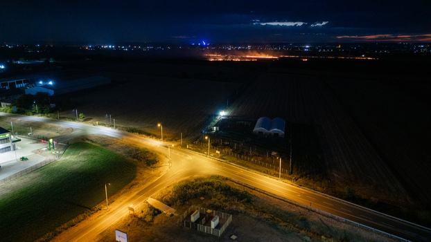 Aerial view of a road intersection illuminated by streetlights at night in Sremska Mitrovica Vojvodina Serbia. Aerial view of a road intersection illuminated by streetlights at night in Sremska Mitrovica Vojvodina Serbia.