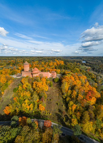 Aerial view of the historic Turaida Castle surrounded by vibrant autumn foliage and dense forests in Sigulda Sigulda Municipality Latvia. Aerial view of the historic Turaida Castle surrounded by vibrant autumn foliage and dense forests in Sigulda Sigulda Municipality Latvia.