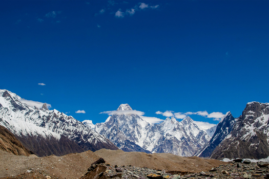 View of towering snow capped peaks of Gasherbrum IV under a clear blue sky in the Karakoram range Skardu Gilgit Pakistan. View of towering snow capped peaks of Gasherbrum IV under a clear blue sky in the Karakoram range Skardu Gilgit Pakistan.