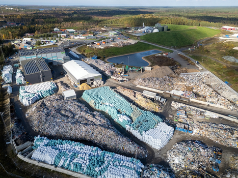 Oulu Finland 25 September 2026 Aerial view of the Rusko waste center featuring large piles of sorted waste industrial buildings storage areas and a retention pond. Oulu Finland 25 September 2026 Aerial view of the Rusko waste center featuring large piles of sorted waste industrial buildings storage areas and a retention pond.