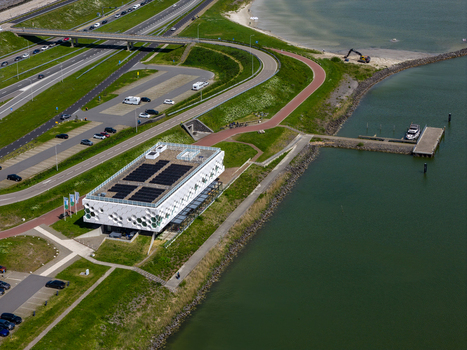 Kornwerderzand Netherlands 14 May 2026 Aerial view of the Afsluitdijk Wadden Center with its modern architecture solar panels and surrounding green landscape by the water. Kornwerderzand Netherlands 14 May 2026 Aerial view of the Afsluitdijk Wadden Center with its modern architecture solar panels and surrounding green landscape by the water.