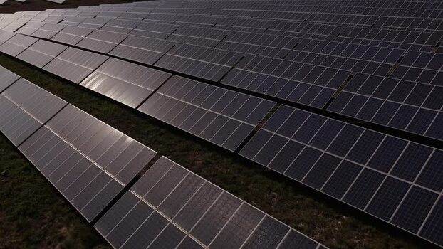 Aerial view of solar panels in a large solar farm Portugal. Aerial view of solar panels in a large solar farm Portugal.