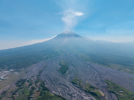Aerial view of Mount Semeru with volcanic ash deposits covering the landscape near Supiturang Village in Pronojiwo East Java Indonesia.