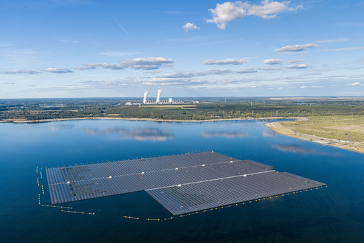 Aerial view of the floating solar farm on Cottbuser Ostsee a former open pit mine with Janschwalde Power Plant in the background Cottbus Brandenburg Germany. Aerial view of the floating solar farm on Cottbuser Ostsee a former open pit mine with Janschwalde Power Plant in the background Cottbus Brandenburg Germany.