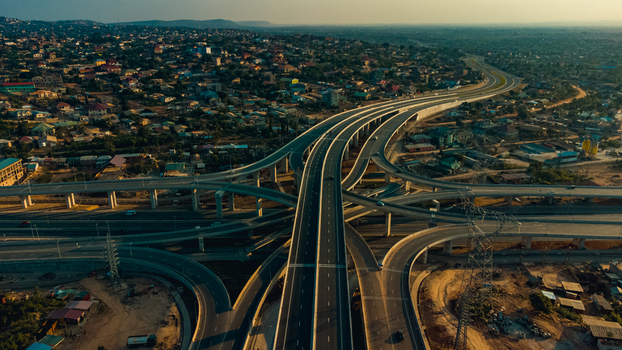 Aerial view of the Pokuase Interchange with multi level highway ramps and surrounding urban residential neighborhoods in Ga North Municipal Greater Accra Region Ghana. Aerial view of the Pokuase Interchange with multi level highway ramps and surrounding urban residential neighborhoods in Ga North Municipal Greater Accra Region Ghana.