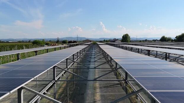 Aerial view of solar panels in an agrivoltaic farm Italy.