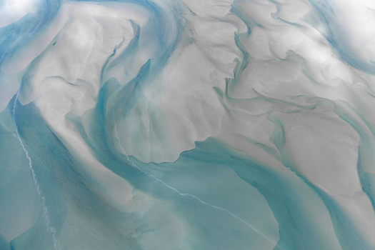 Aerial view of the intricate sandbanks and turquoise tidal channels of Senja Troms Norway.