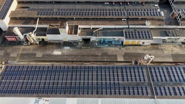 Aerial view of solar panels on industrial rooftops in Bulgaria. Aerial view of solar panels on industrial rooftops in Bulgaria.