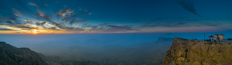 View of the panoramic mountain landscape and rugged cliffs at Gorakh Hill Station during a vibrant sunset in Gorakh Hill Sindh Pakistan.