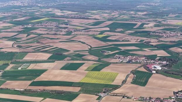 Aerial view of patchwork fields and villages France.