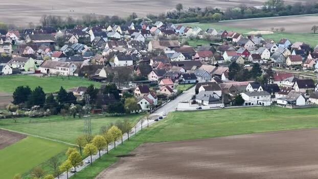 Aerial view of houses and green fields France.