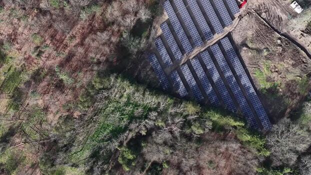 Aerial view of solar panels near water Portugal.