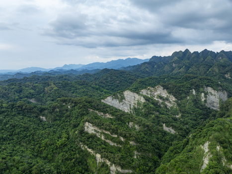 Aerial view of lush green mountains and rocky ridges in Puli Township Nantou County Taiwan. Aerial view of lush green mountains and rocky ridges in Puli Township Nantou County Taiwan.