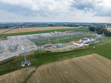 Aerial view of Umspannwerk Ottenhofen electrical substation with high voltage transmission towers and electrical infrastructure surrounded by agricultural fields in Ottenhofen Bayern Germany.