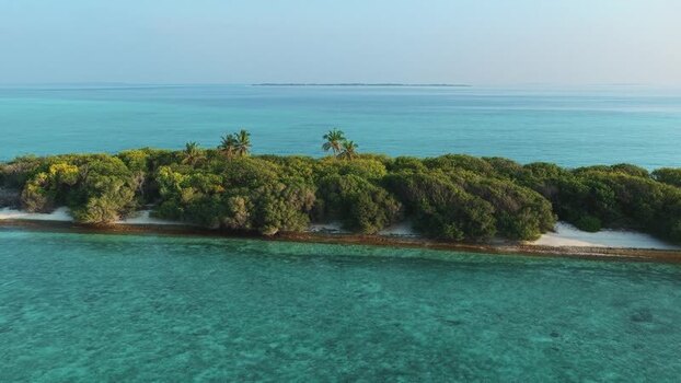 Aerial view of a tropical island and turquoise sea Maldives. Aerial view of a tropical island and turquoise sea Maldives.