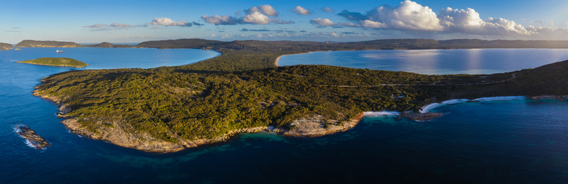 Aerial view of Camp Quaranup on the Vancouver Peninsula featuring lush coastal vegetation rocky shorelines and turquoise waters in Vancouver Peninsula Western Australia Australia. Aerial view of Camp Quaranup on the Vancouver Peninsula featuring lush coastal vegetation rocky shorelines and turquoise waters in Vancouver Peninsula Western Australia Australia.