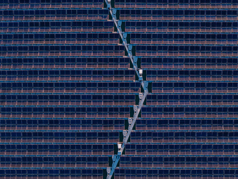 Aerial view of floating solar farm with rows of panels and a central walkway on the water in Bensheim Hessen Germany. Aerial view of floating solar farm with rows of panels and a central walkway on the water in Bensheim Hessen Germany.