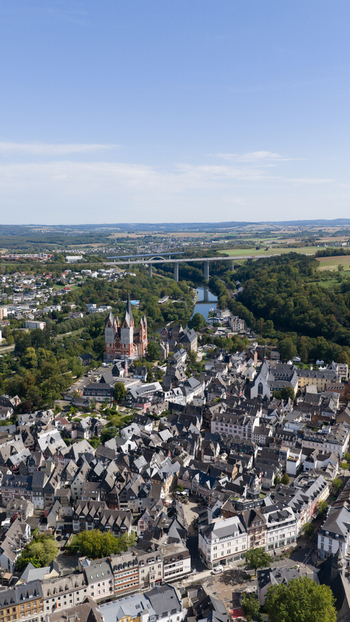 Aerial view of Limburg Cathedral surrounded by the historic old town Lahn river and lush greenery in Limburg an der Lahn Hessen Germany. Aerial view of Limburg Cathedral surrounded by the historic old town Lahn river and lush greenery in Limburg an der Lahn Hessen Germany.