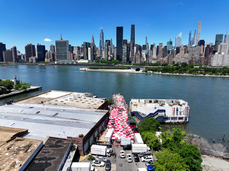 Long Island City United States 13 June 2026 Aerial view of fans holding a massive Croatian flag on a pier with the Manhattan skyline and East River in the background.