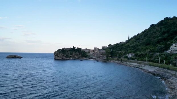 Aerial view of the rocky coastline and hills in Italy.