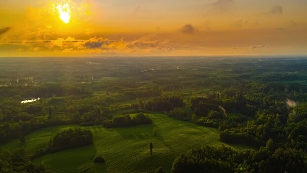 Aerial view of rolling green hills at sunset in Latvia. Aerial view of rolling green hills at sunset in Latvia.