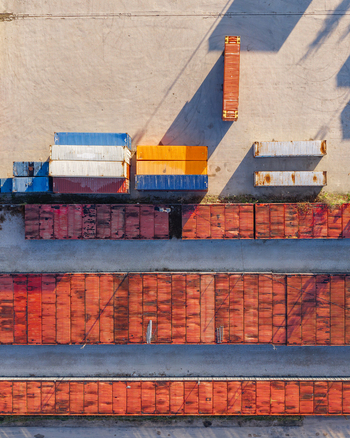 Aerial view of colorful cargo containers arranged in rows at a shipping yard in Warsaw Masovian Voivodeship Poland.