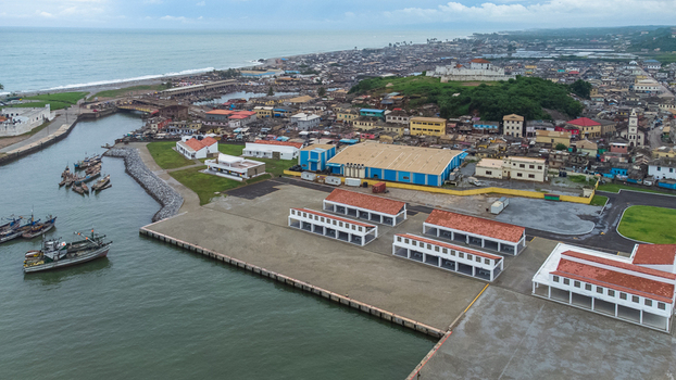 Aerial view of Elmina Castle overlooking the historic fishing harbor and coastal town of Elmina Central Region Ghana. Aerial view of Elmina Castle overlooking the historic fishing harbor and coastal town of Elmina Central Region Ghana.