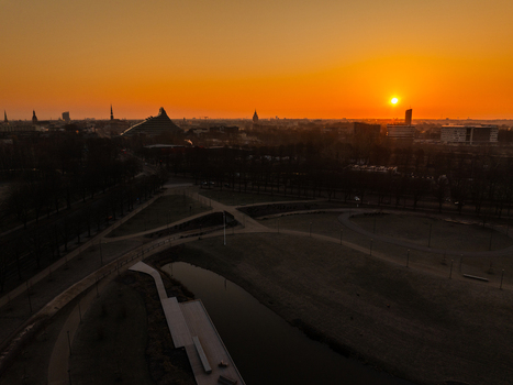 Aerial view of Uzvaras parks and Uzvaras bulvaris at sunset with the city skyline of Riga in the background Riga Latvia.