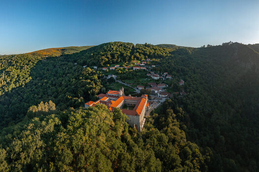 Aerial view of the Monastery of Santo Estevo de Ribas de Sil nestled in the lush green forests of the Ribeira Sacra region in O Covelo Ourense Spain.