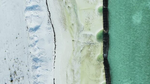 Aerial view of airport construction and turquoise sea Maldives. Aerial view of airport construction and turquoise sea Maldives.