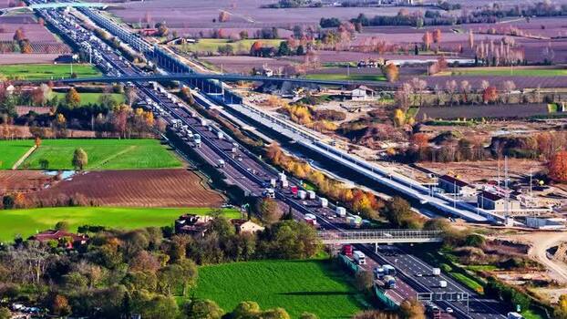Aerial view of highway traffic in Italy.