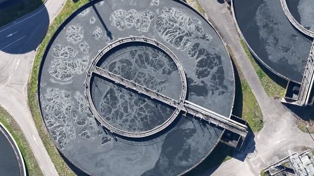Aerial view of circular water treatment plants France.